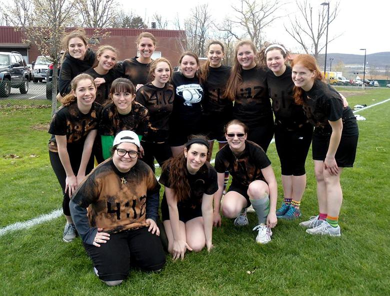 Members of Women's Group pose on one of Marywood's fields after a group kickball activity.