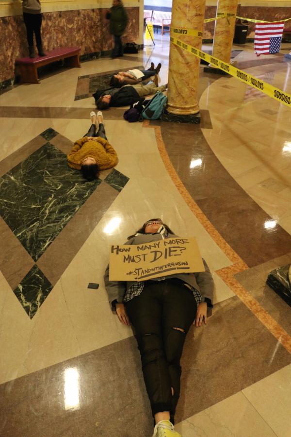 A student protester displays a sign during the protest in support of Ferguson.