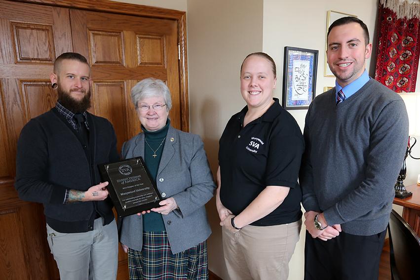 SVA members pose with president Sr. Anne Munley, I.H.M., Ph. D.