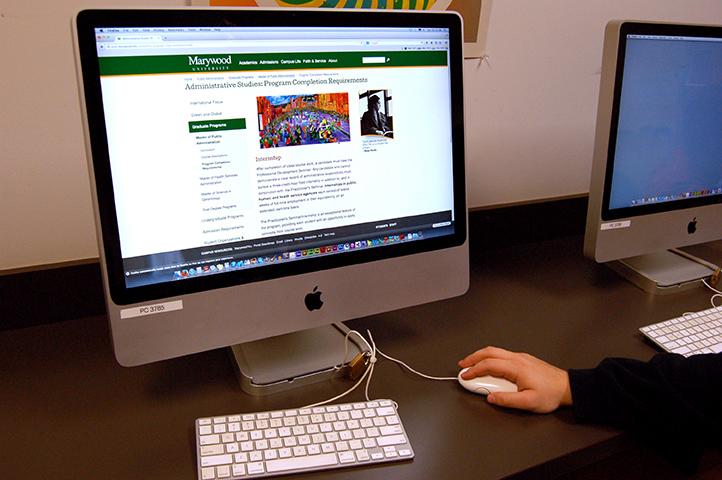 Student looks over the Public Administration on Marywoods website.