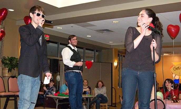 Emcees+Frank+Winger+and+Ryan+Kozich+ask+candidate+Dana+Boeh+questions+at+the+Date+Auction+held+on+Feb.+13.+