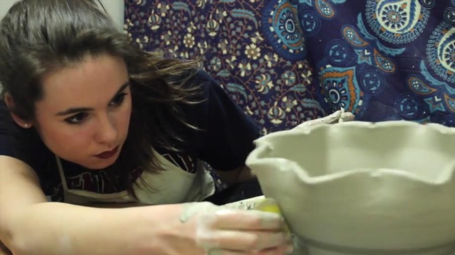 Sophomore ceramic and art administration major Emma Pilon crafts a bowl in preparation for the bowl. 