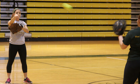  Mackie Goodwin practices in the gym with the softball team. 