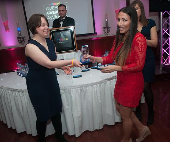 AAF Board Member and Marywood Alum Desiree Zielinski presents an award  to Nailea Meneses