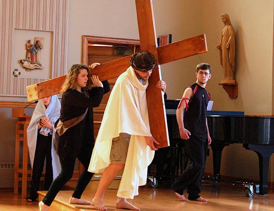 Miranda Micciche, Josh Moore, and Chris Wall perform in the Passion Play.