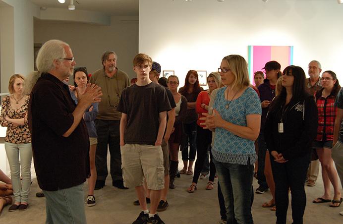 Bob Schweitzer, Curator of the Maslow Collection, talks with Associate Professor Pamela Parsons about her piece in the Marywood Faculty Biennial.