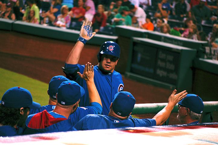 The Cubs' Kyle Schwarber high fives his team during a game against the Philadelphia Phillies on Sept. 12 at Citizens Bank Park. 