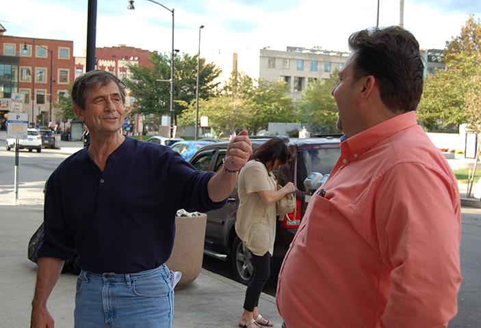 Admiral Joe Sestak talks to Lackawanna County Democratic Party Chairman Chris Patrick outside of the Northern Lights Café. 