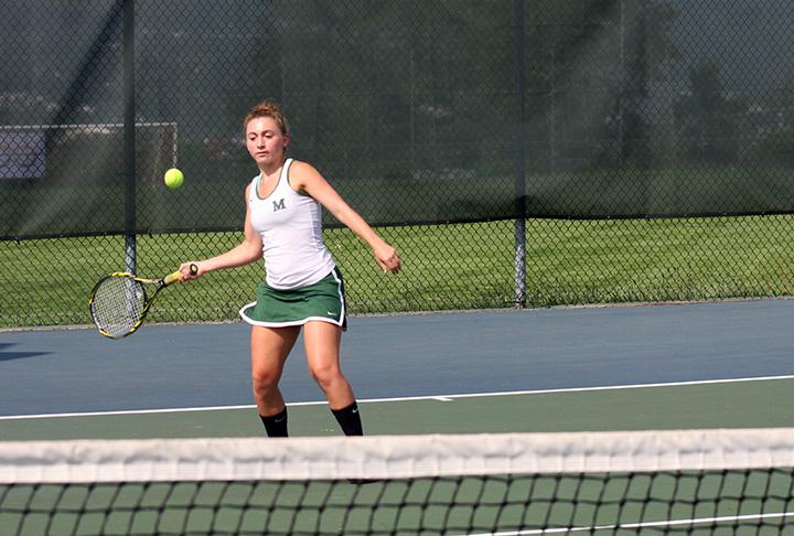 Tennis player Avery McCall playing tennis.