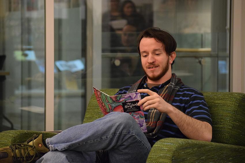 Student Travis Murray reads his winning Bayleaf submission called Goblin Darts at the Bayleaf Live event on Jan. 20. 