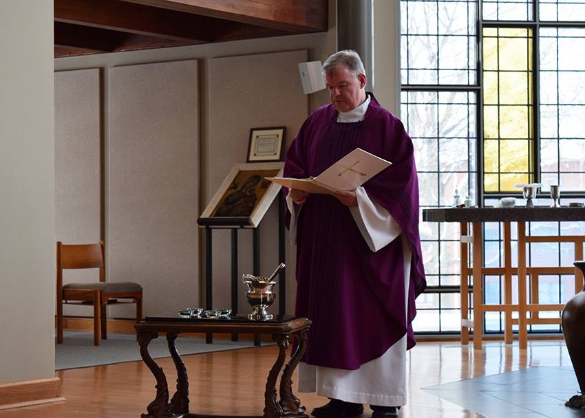 Rev.+Joseph+Elston+blesses+the+ashes+during+the+Ash+Wednesday+Mass+that+was+held+at+noon+in+the+Marian+Chapel.+Today+marks+the+start+of+the+Lenten+season+for+Catholics.+