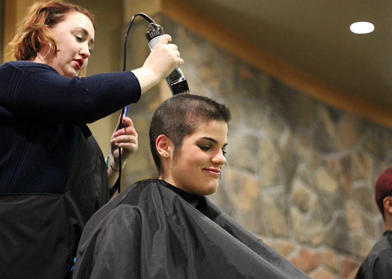 Freshman Jenna Fallone gets her hair shaved off for the Goin’ Bald for Bucks fundraiser. 