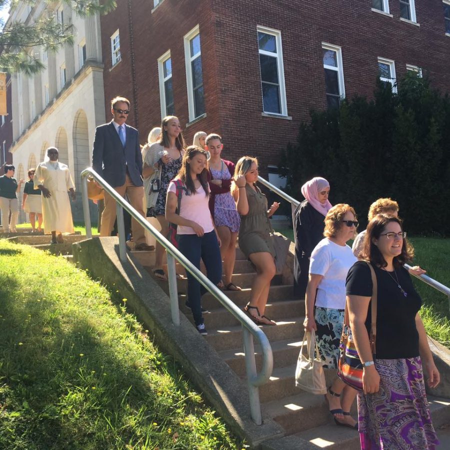 Community members make their way to the Opening Liturgy.