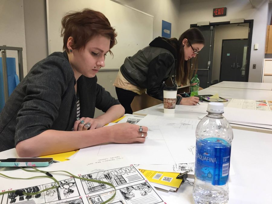 Senior illustration majors Cassidy Lesione and Deanna Szabo work on their projects in the Insalaco Center for Studio Arts.