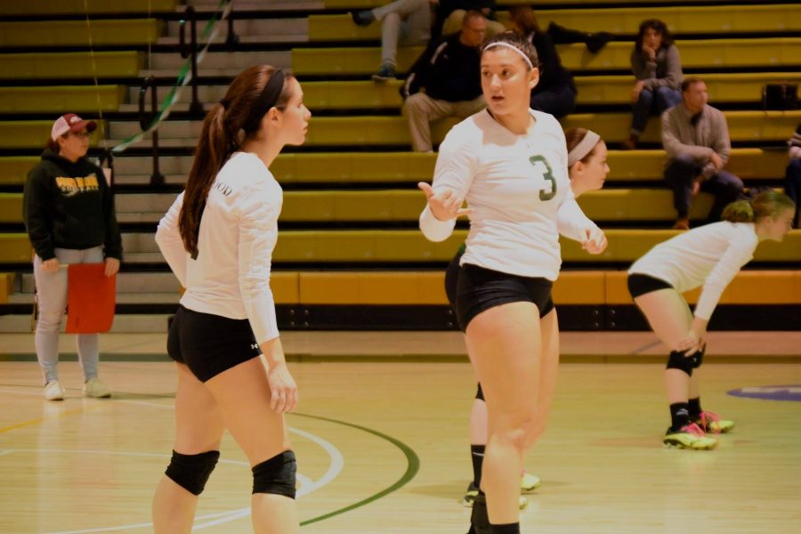 Sophomore Mallorie Deschaine talking strategy during the match