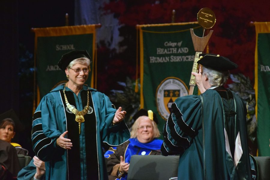 Sr. Anne presents Sr. Mary with the University Mace.