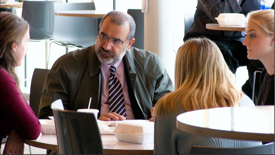 A Chartwells' representative sits with students to discuss concerns about dining services.