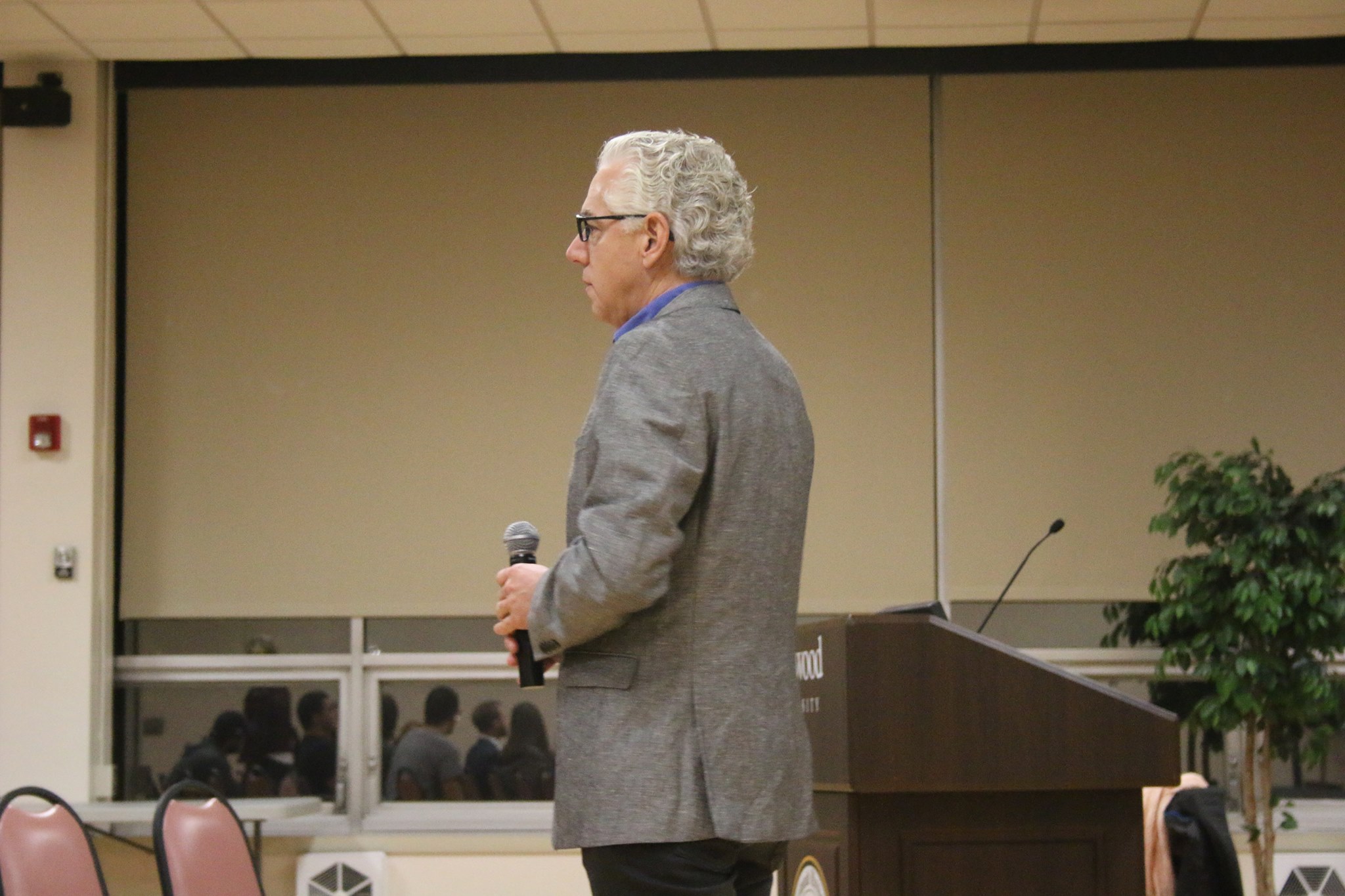 Robert May speaks to the audience after the screening