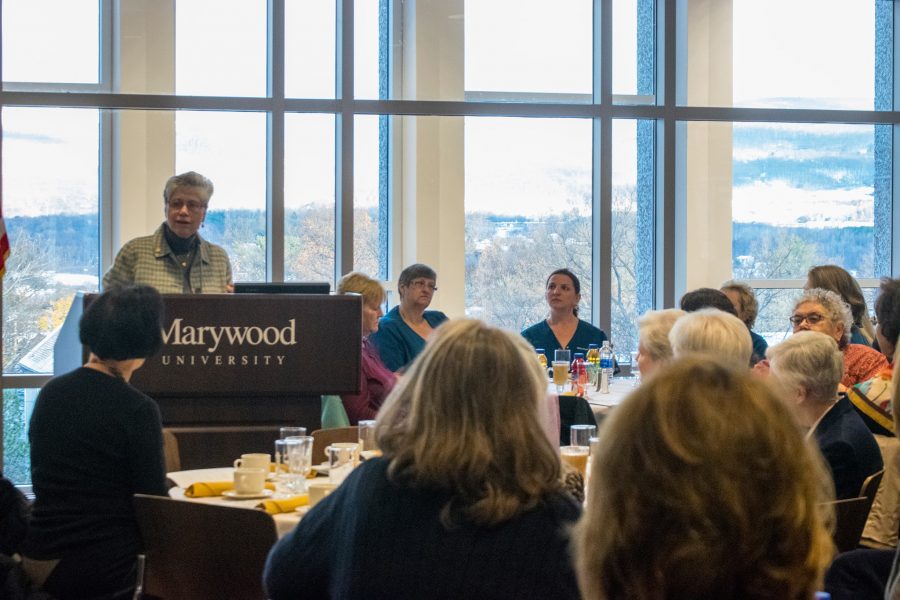 Sister Mary Persico addresses a crowd of staff, faculty, administration and guests at the annual Thanksgiving Prayer Breakfast