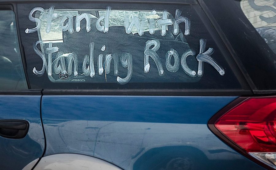 A car window was painted with the popular support phrase Stand with Standing Rock. Photo courtesy of Dr. Michael Mirabito (Copyright 2016)
