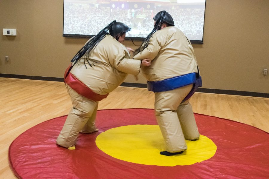 Tim Hackenberg, a third year architecture major, and Jarek Diehl, a third year interior architecture major, face off in a sumo wrestling match.