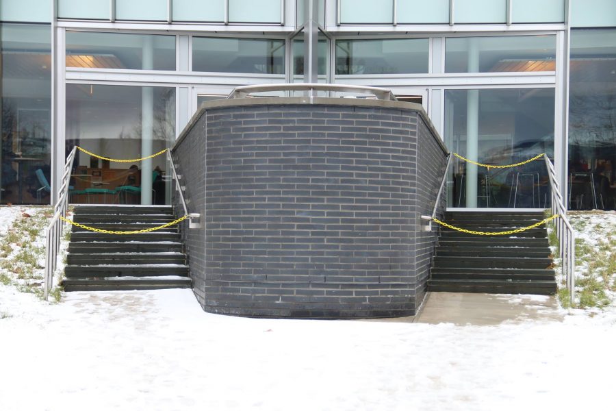 Yellow chains block the steps in front of the Learning Commons.
