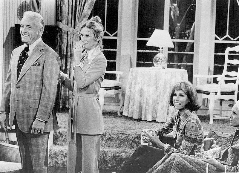 Photo is in public domain. Publicity photo of Ted Knight, Cloris Leachman, Mary Tyler Moore and Valerie Harper from The Mary Tyler Moore Show. In this episode, Phyllis talks Ted into running for local public office via Wikimedia Commons