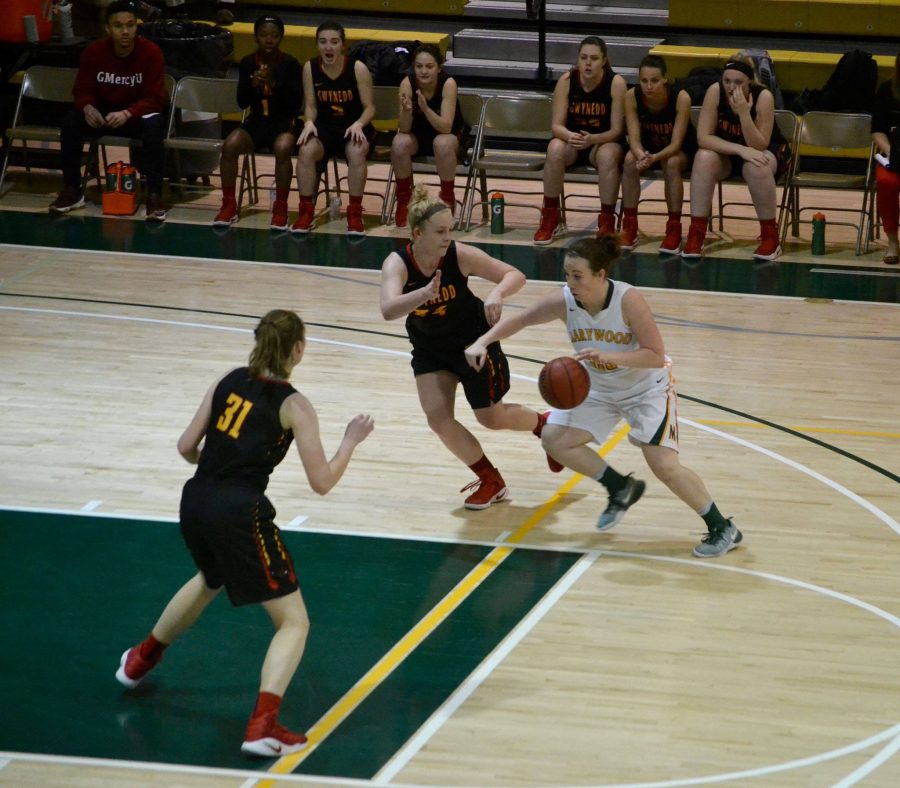 Sophomore guard Alyssa Olson drives to the lane in teams seventh straight victory.
