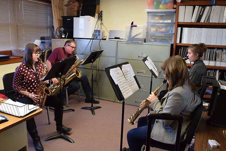 The members of Pour Four work together on a piece.