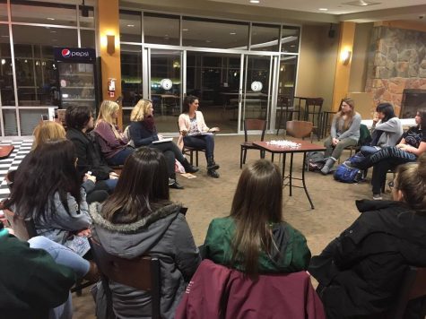 Alyssa Reilly, a junior communication sciences and disorders major, begins the first meeting of Romance Revolution by discussing the groups goals and mission statement.