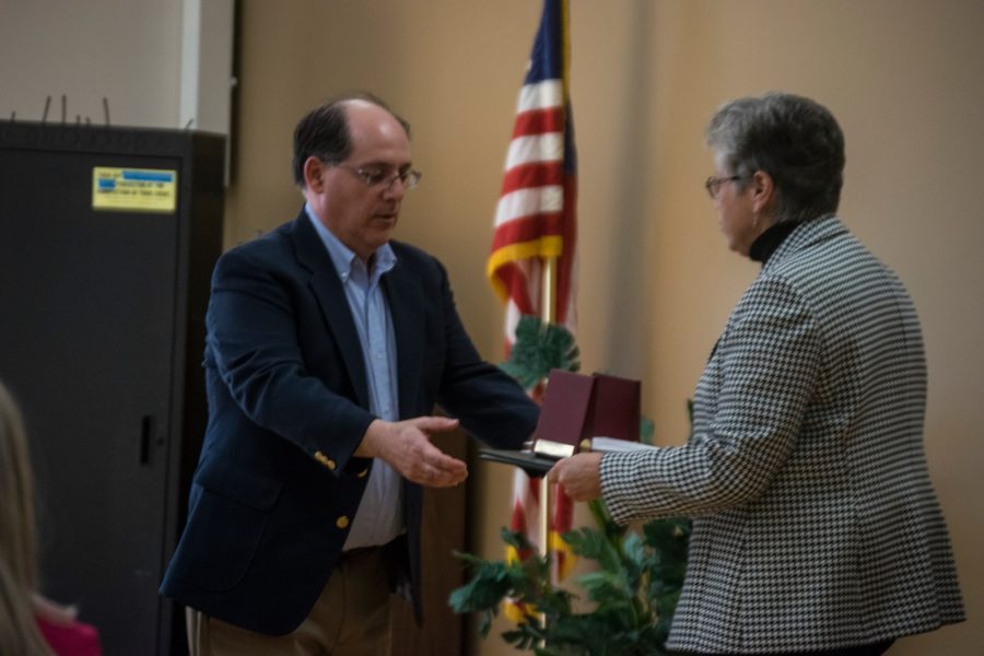 Frank Falcone, an institutional data specialist, accepts his award for 25 years at Marywood.