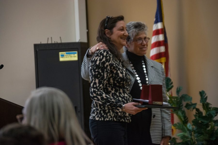 Judith Snyder, production manager for the music, theatre and dance department, poses for a photo after receiving her award for 25 years at Marywood.