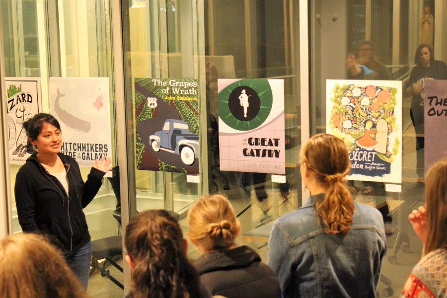 Stephanie Juarez Ventura, a graphic design major, explains her redesigned cover for "The Grapes of Wrath."