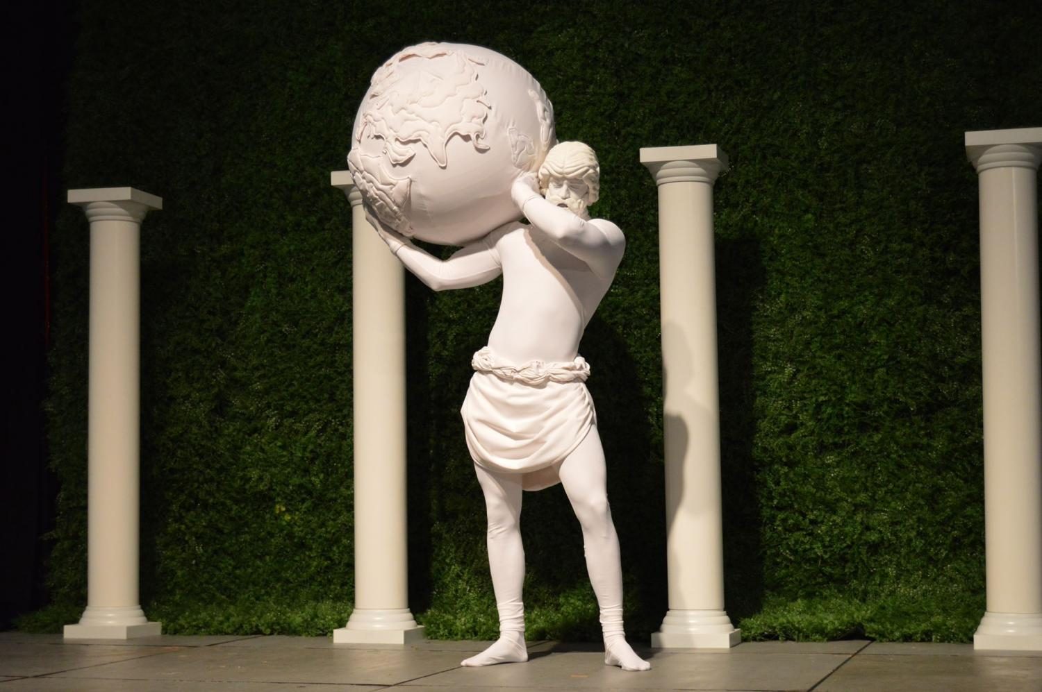 A living sculpture of Atlas held up a globe to contribute to the “Windows to the World” theme.
