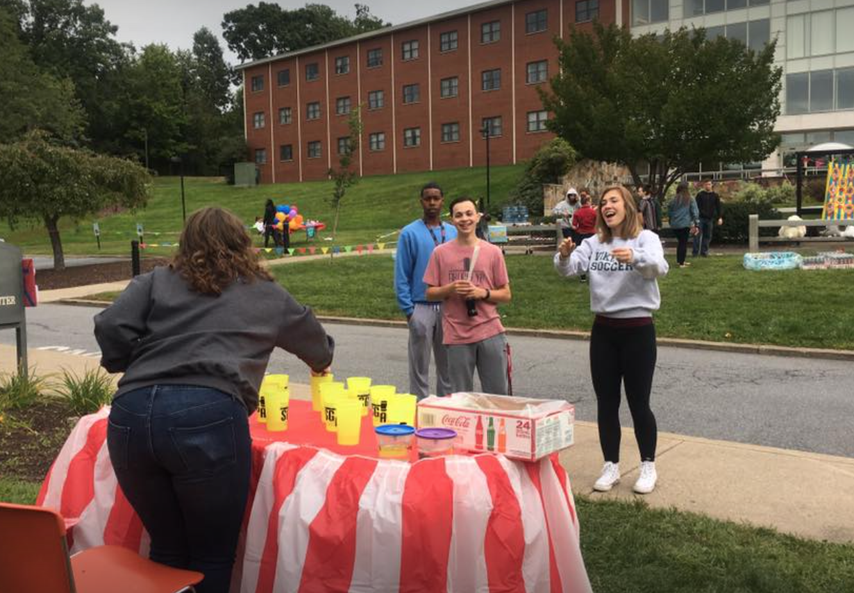 Sophomore graphic design major April Foley cheered when she landed a shot that won her a goldfish.