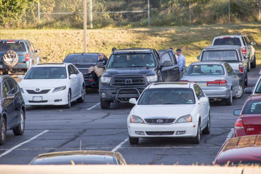 The suspect’s vehicle, a black Toyota pickup, was searched in the upper pit parking lot behind Loughran Hall.