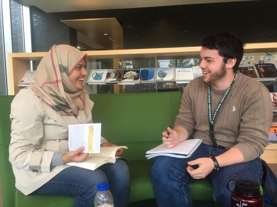 Salma Ahmed and Mike Carone, co-facilitators of the event, talk in the Learning Commons.