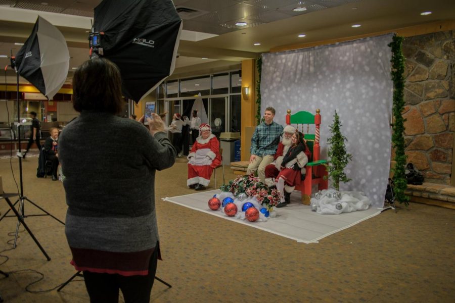 Laura Burns snaps a photo of her children Tristan and Peyton posing with Santa.