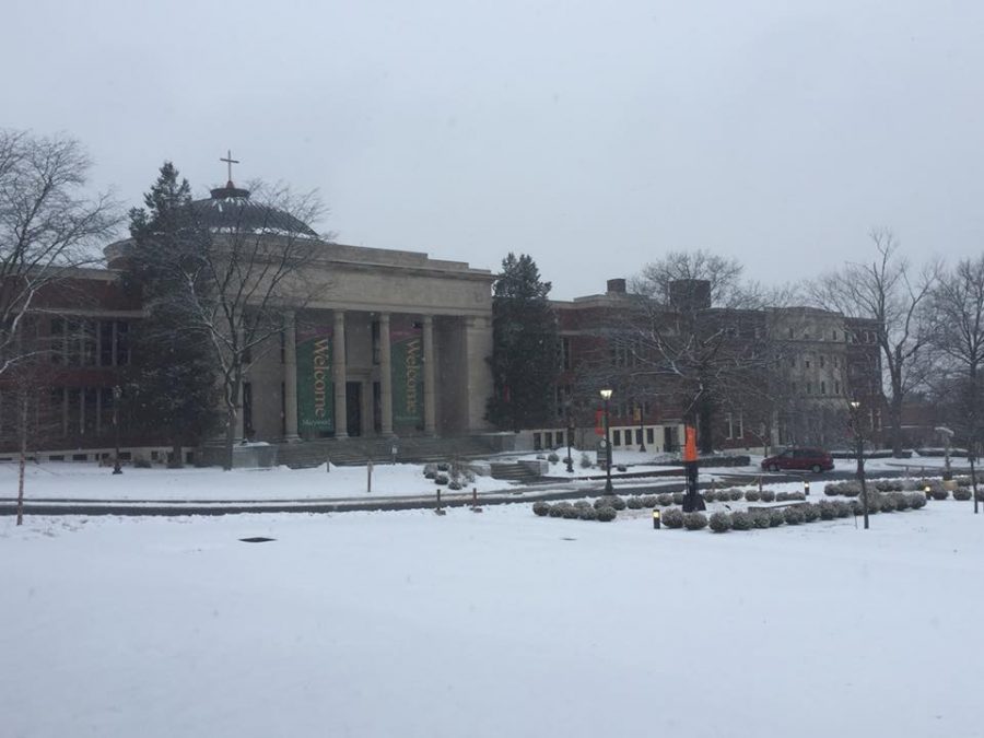Snow falls outside the Liberal Arts Center the day before classes start for the spring 2018 semester.