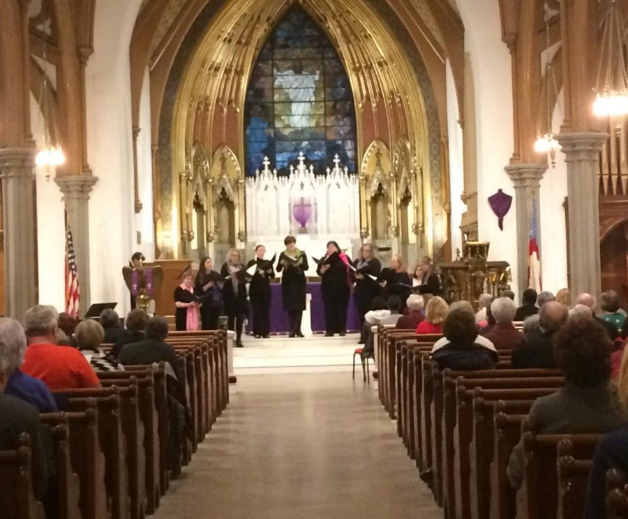 Community members gather for a vigil in honor of victims of gun violence. Photo credit: Briana Ryan