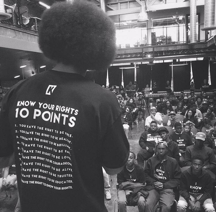 Kaepernick speaks to youth at one of his Know Your Rights Camp events.