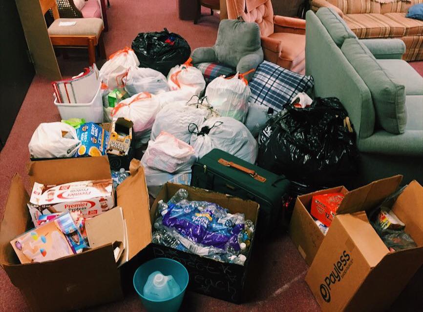 Project Outreach volunteers sort a variety of donations into categories before taking them to charities. Photo courtesy of Carley Sliwka