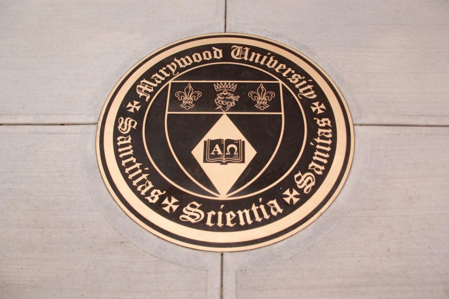 Maywood's Memorial Arch now features a bronze version of the university's seal. Photo credit: Tatiana Tell