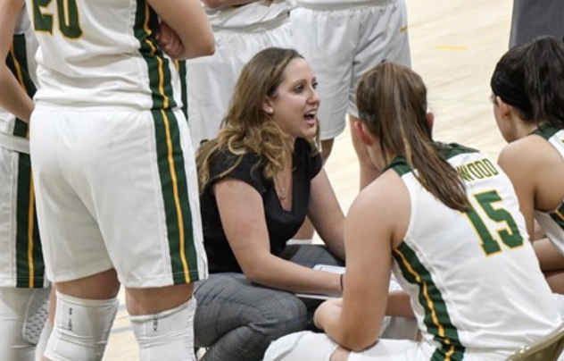 Head Coach Gabby Holko speaks with the team. (Photo credit/ Carey Action Photography; Photo courtesy of Marywood Athletics)