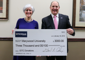 Patricia Rosetti, Leadership Annual Giving Officer, accepted the $3,000 donation from Jerry Champi, FNCB Bank President and CEO, to help further the Momentum Program. IMAGE CREDIT: Marywood Universitys Marketing & Communications Department