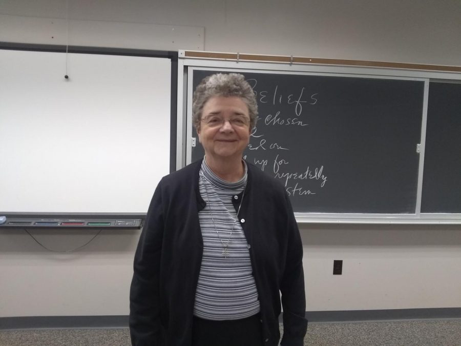 Sister Maria Rose Kelly awaits the arrival of her students for Modern Belief Wednesday morning. Photo credit: Elizabeth Deroba