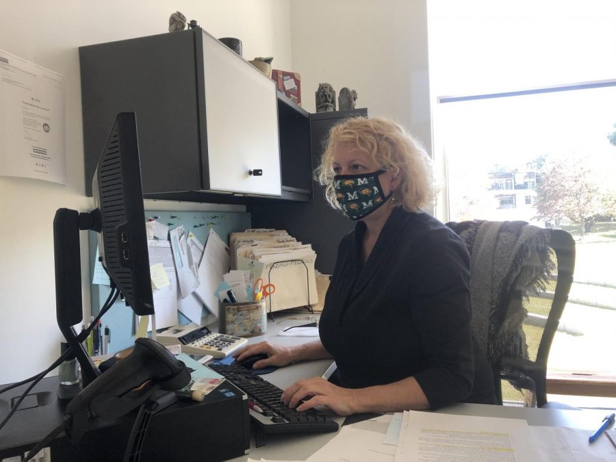 Mary Kay Maldonato, interlibrary loan clerk, works in her office in the Learning Commons. Due to COVID-19, safety protocols such as mandatory masks have been implemented at the Learning Commons.
