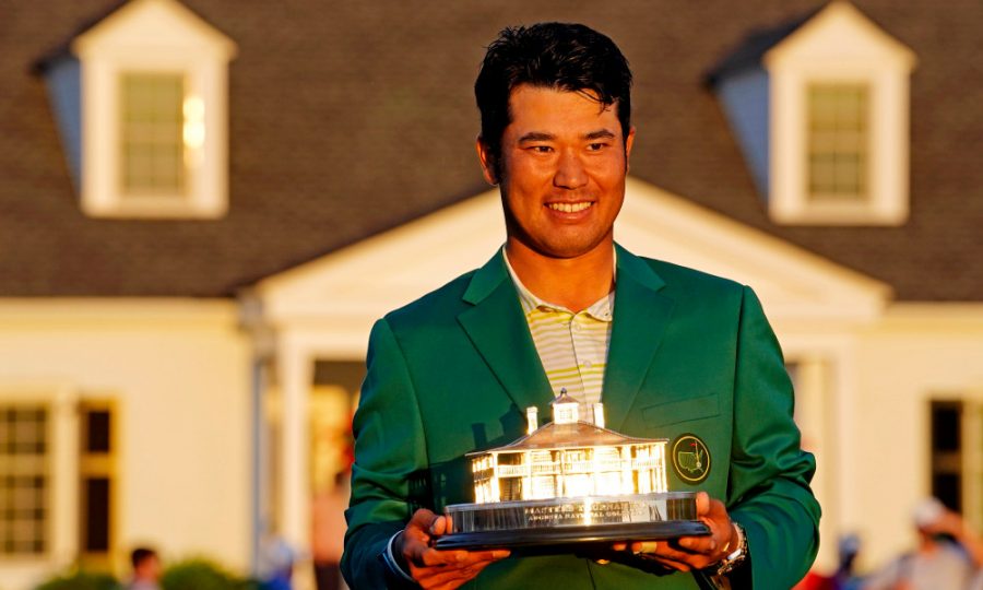 Hideki Matsuyama dons the iconic green jacket after his historic win at the Masters Tournament.