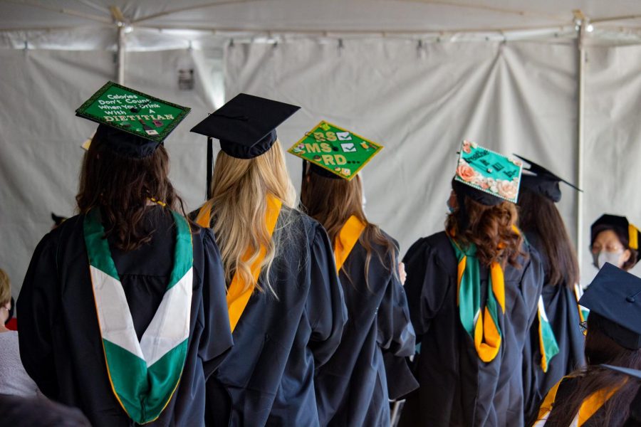 Students wait to receive their diplomas at the first of four commencement ceremonies.