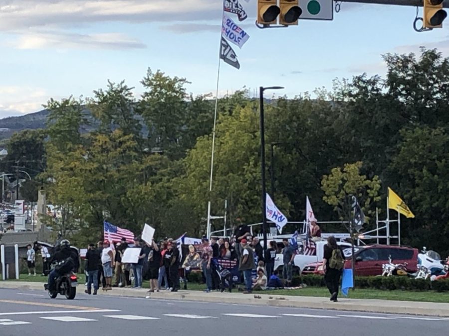 Protestors gather outside of the museum where the president spoke.